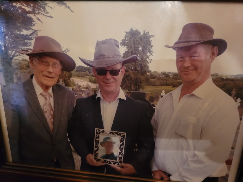 Michael and His Two Sons Holding a Photo of Andrew Michael and His Two Sons Holding a Photo of Andrew